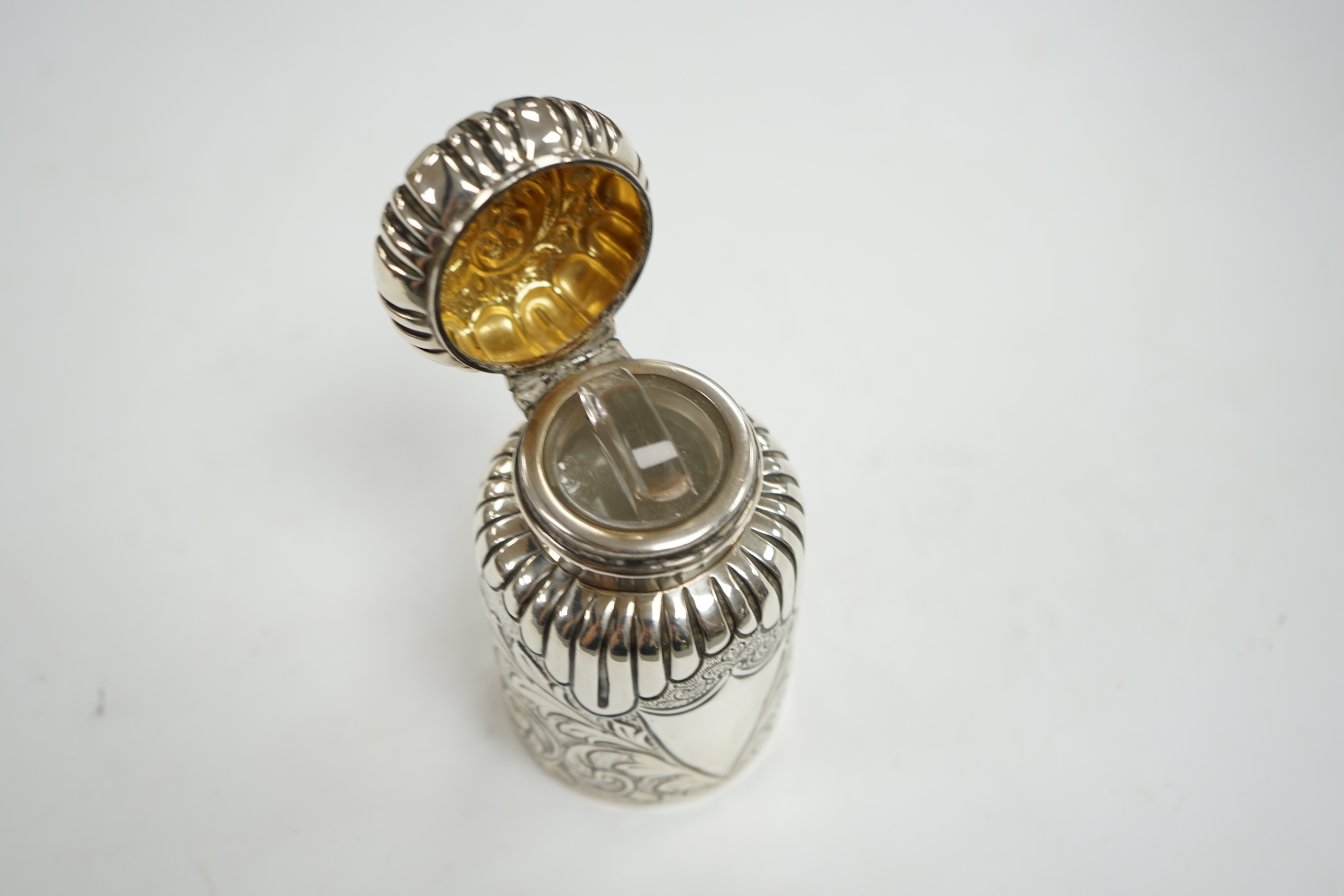 A late Victorian embossed silver scent bottle, by Arthur Wilmore Pennington, Birmingham, 1890, 95mm. Condition - poor to fair